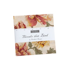 May include: A fabric square with a floral print in shades of pink, yellow, and green. The fabric is labeled "Threads that Bind" by Blackbird Designs.