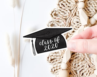 May include: Black and white graduation cap sticker with the text "class of 2020" on a white background.