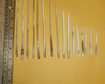Deer and Elk leg bone needles, also several buffalo horn needles.