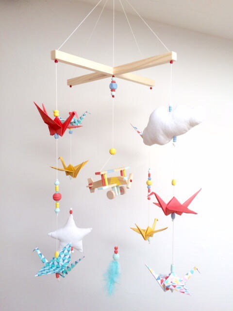 vintage style. Origami baby mobile with airplane blue night