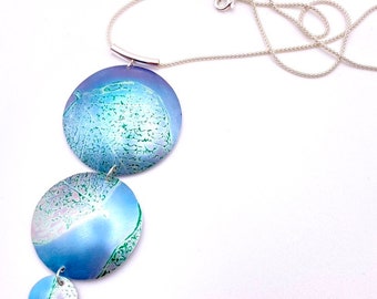 Pendant necklace in anodised aluminium on silver chain anodized aluminum triple dome with leaf print jewellery