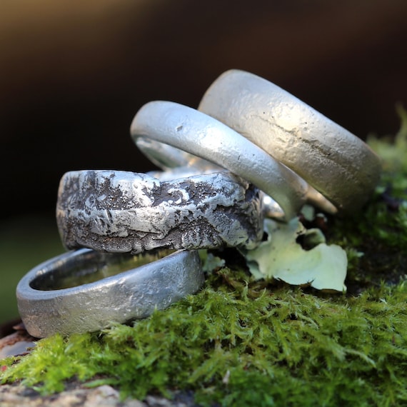 Upcycled rings made with soft solder on pure silver hammered bands