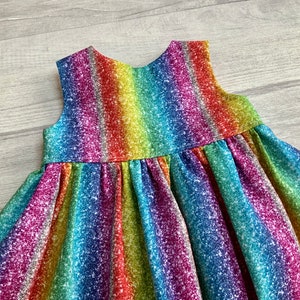 Girls Rainbow Stripe Sleeveless dress in a sparkle effect cotton fabric,  matching bloomers and headband option, available  0-10 years,