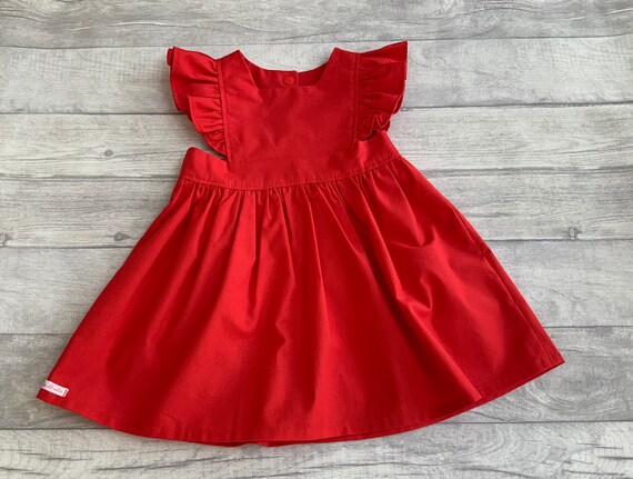 Ladies red top pinafore dress
