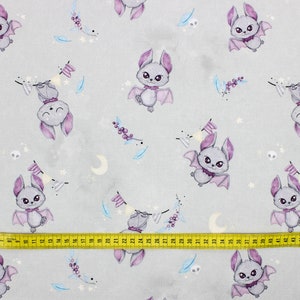 Gray bats cotton fabric folded to show smooth print and detail