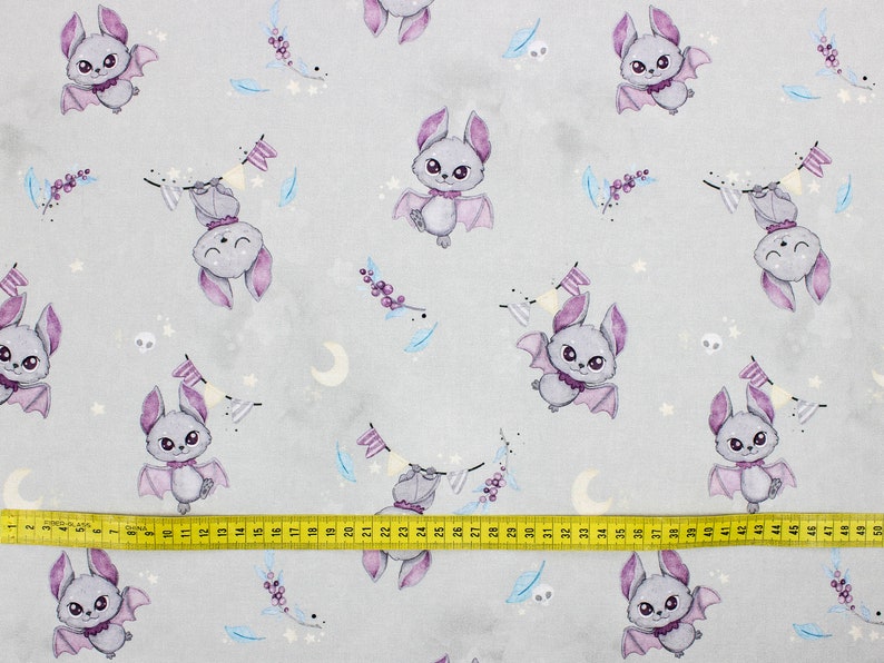 Gray bats cotton fabric folded to show smooth print and detail