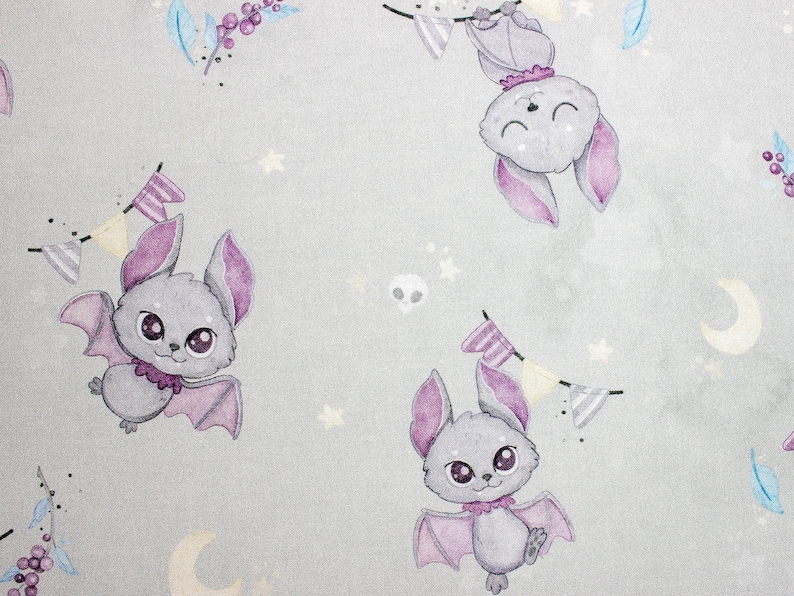 Close up of cartoon gray bats on premium cotton fabric