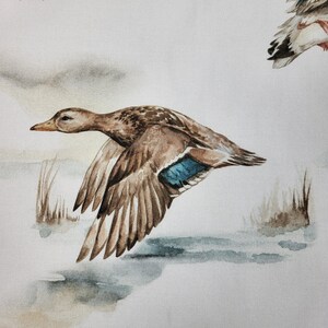 Close up of duck and lake pattern on premium cotton fabric