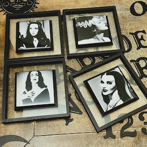 Custom Black Glass Wall Frames featuring the Gothic Babes ~ Vampira, Morticia Addams, Lily Munster, and the Bride of Frankenstein