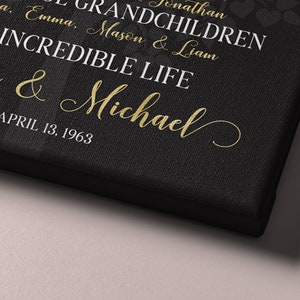 May include: Black canvas with gold text that reads "Susan & Michael" and "April 13, 1963". The text also includes the names "Maya, Emma, Mason & Liam" and "Grandchildren".
