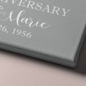 Puede incluir: Un lienzo gris con texto blanco que dice "Anniversary John & Marie December 26, 1956".