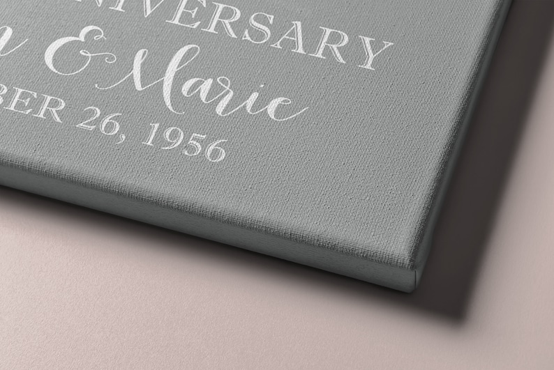 Puede incluir: Un lienzo gris con texto blanco que dice "Anniversary John & Marie December 26, 1956".