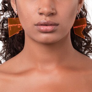 Clear neon orange acrylic prototype earrings