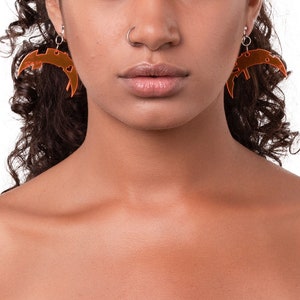 Clear neon orange acrylic moon glitch earrings