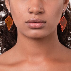 Clear neon orange acrylic crystal glitch earrings