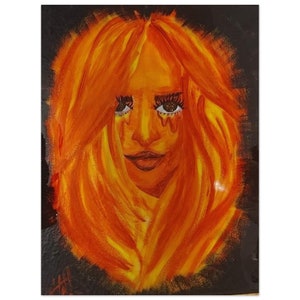 May include: A painting of a woman's face with long, flowing hair. The woman's hair is painted in shades of orange and yellow, resembling flames. Her eyes are closed and she has a soft smile on her face.