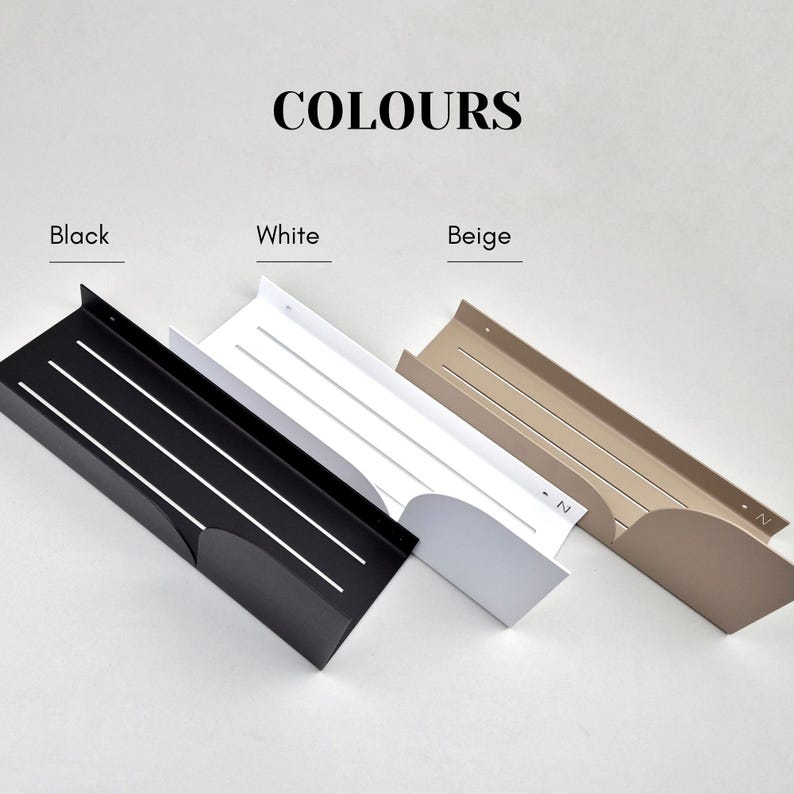 May include: Three wall shelves in black, white, and beige. Each shelf has a curved edge and a series of parallel lines.
