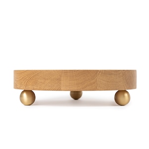 Decorative wooden tray with brass legs, 20 cm diameter