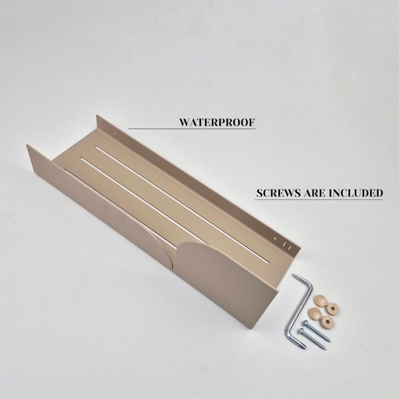 May include: A beige metal shelf with three horizontal slots and rounded edges. The shelf is designed to be mounted on a wall. The text "WATERPROOF" and "SCREWS ARE INCLUDED" are visible in the image. The shelf comes with two screws and two plastic anchors.