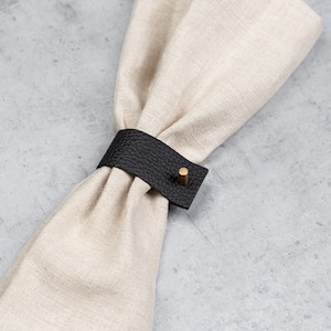 Black napkin ring with brass pin