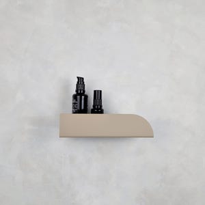 Beige metal wall shelf for cosmetics