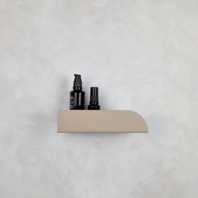 Beige metal wall shelf for cosmetics