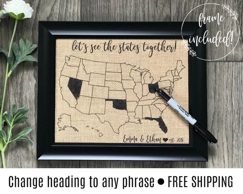 May include: A black framed burlap map of the United States with the text "let's see the states together!" and "Ella & Elhayat est. 2015".