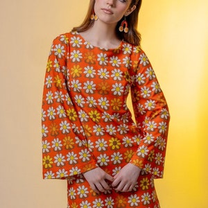 Daisies print mini dress. Flared sleeve mini dress. Orange mini dress. Groovy mini dress.