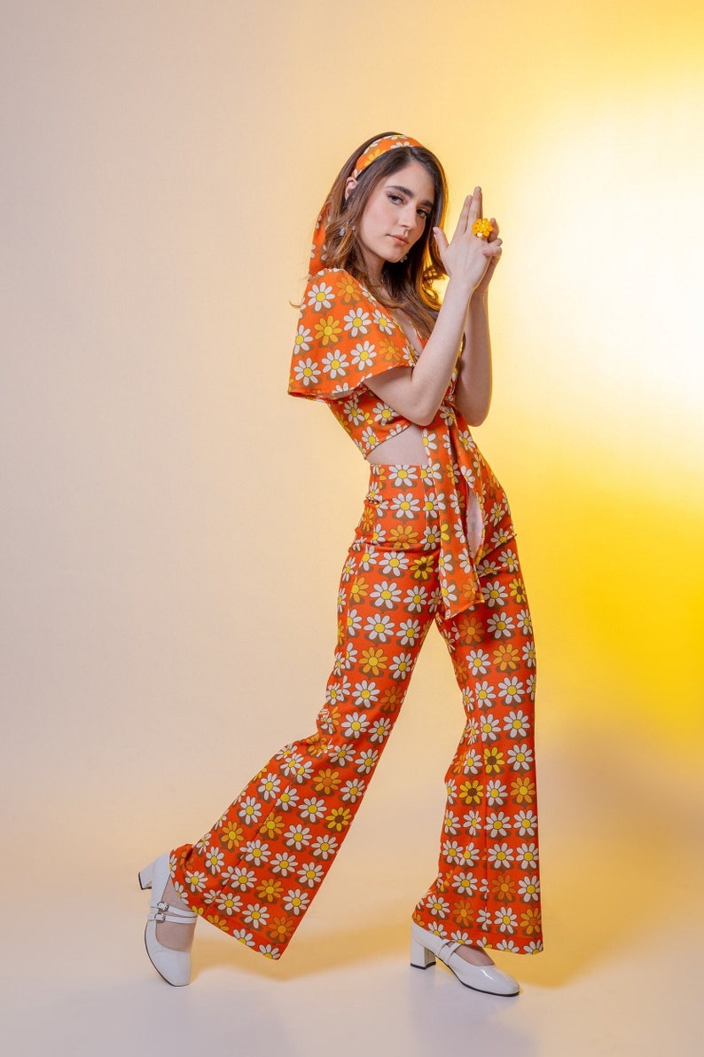 60s Pants, Jeans, Hippie, Flares | 60s Jumpsuits, Overalls     Retro trousers. Orange pants. The Swinging Daisies Wide Leg Trousers.  AT vintagedancer.com