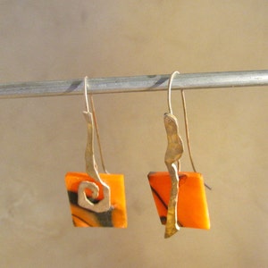 Acrylic with sterling ear dangles.