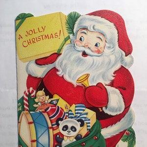 Vintage CHRISTMAS CARD para Niños - SANTA con bolsa de Juguetes.  Páginas de actividades.  Sin usar con sobre Navidad recordado - 4 "x 6"