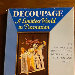 May include: Book cover with a blue background and the title "Decoupage: A Limitless World in Decoration". The cover features a colorful illustration of a decoupage project with flowers, a figure, and a checkered pattern. The book is by Dorothy Harrower and includes 16 color plates and 72 black and white illustrations.