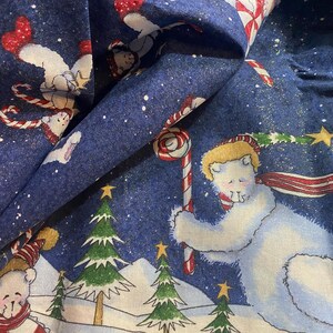 May include: Blue fabric with a winter holiday theme. The fabric features white polar bears wearing red and white scarves and hats, holding candy canes. The background is a snowy scene with Christmas trees and stars.