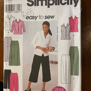 May include: A sewing pattern for a white blouse, a floral print vest, a green skirt, white pants, black cropped pants, and pink pants. The pattern is from Simplicity and is labeled "easy to sew".