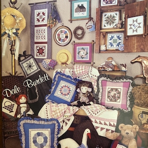 May include: A set of three ceramic mugs with a speckled, matte finish. The mugs are in shades of cream, light gray, and dark gray. Each mug has a simple, minimalist design and a rounded handle.