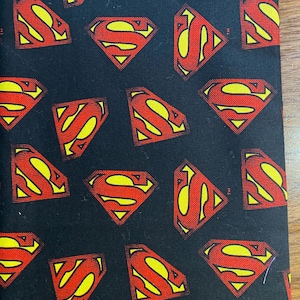 Cartoon Superman Symbol fabric Black  Background - 19" long x 44" wide -