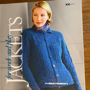 May include: A book titled "Jackets for work and play" featuring a woman wearing a blue knitted cardigan with a white and blue patterned scarf. The book is published by "theBest of Knitter's" and has a blue and white logo with the word "BOOKS" on the cover.