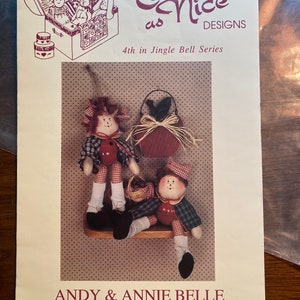 May include: A pattern for making two 8-inch tall rag dolls, Andy and Annie Belle. The pattern is part of the Twice as Nice Designs Jingle Bell Series, and uses a jingle bell for the body. The dolls can be made to sit on a shelf or hang on a peg.