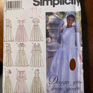 May include: A Simplicity sewing pattern for a wedding dress. The pattern includes five different dress styles, with a variety of necklines, sleeves, and skirt shapes. The pattern also includes instructions for making a veil. The pattern number is 990.