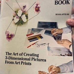 May include: A Basic Paper Tole Instruction Book with the text "The Art of Creating 3-Dimensional Pictures From Art Prints." The cover features a floral design and illustrations of art supplies. Published by GEMÉ ART, INC. Book #PTB 90.