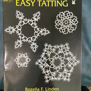 May include: A black book with the title "Easy Tatting" and the author "Rozelle F. Linden". The cover features four white tatted lace designs.