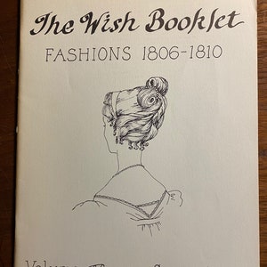 May include: The Wish Booklet: Fashions 1806-1810, Volume XV by Susan Sirkis. A black and white illustration of a woman's back with an elaborate hairstyle and a simple dress.