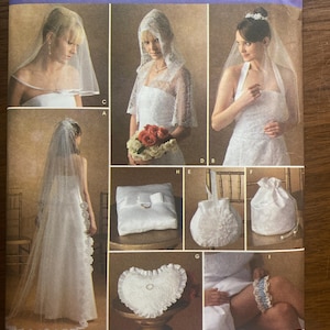 May include: Simplicity sewing pattern 4216 for wedding accessories including various veils, a ring pillow, a heart-shaped pillow, a drawstring bag, and a garter. The envelope features photographs of finished items and the text Simplicity 4216.