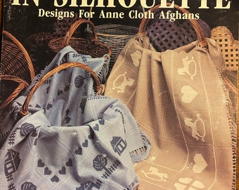 Afghani in silhouette Schema punto croce per Anne Cloth Afghani - Caso Sandra Graham - Leisure Arts 722 - 1989 - Filo contato - Coperte