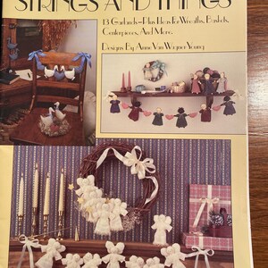 May include: A craft leaflet titled "Strings and Things" with a cover image featuring a wreath and garland of angels. The leaflet is from Leisure Arts Craft Leaflets and is numbered 1057. The text on the cover reads "13 Garlands - Plus Ideas for Wreaths, Baskets, Centerpieces, and More. Designs by Anne Van Wagner Young."