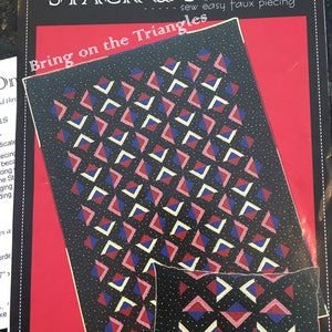 May include: A quilting pattern booklet with the title "Stack & Stitch - Sew Easy Faux Piecing: Bring on the Triangles". The cover features a black background with a red, blue, and white geometric pattern. The pattern is also shown on a smaller pillow.