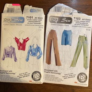 May include: Two boxes of Click & Sew sewing patterns. The boxes are white with blue and red text. The left box shows a red blouse and the right box shows a pair of pants. Both boxes have the text "Create custom sized sewing patterns on your computer!" and "Windows 95/98 CD-ROM Inside".