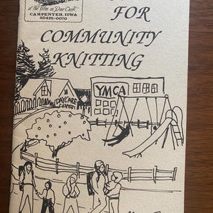 May include: A vintage booklet titled "Projects for Community Knitting" with a black and white illustration. The cover features a drawing of a community scene with a YMCA, playground, and people. The Cottage Creations logo is in the upper left corner.