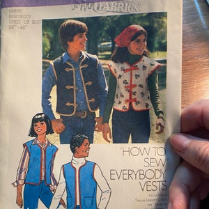 May include: A sewing pattern for vests, Simplicity pattern number 7607. The pattern includes instructions for making vests for both adults and children. The pattern is for sizes 38-40 inches.