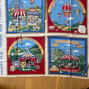 May include: Four fabric panels with a red, white, and blue color scheme depicting scenes from a county fair. The panels feature a Ferris wheel, hot air balloons, a quilting bee, and a merry-go-round. The text on the panels reads "Meet Me At The Fair", "Hot Air Balloon Rides", "The Quilting Bee", and "Merry-Go-Round".
